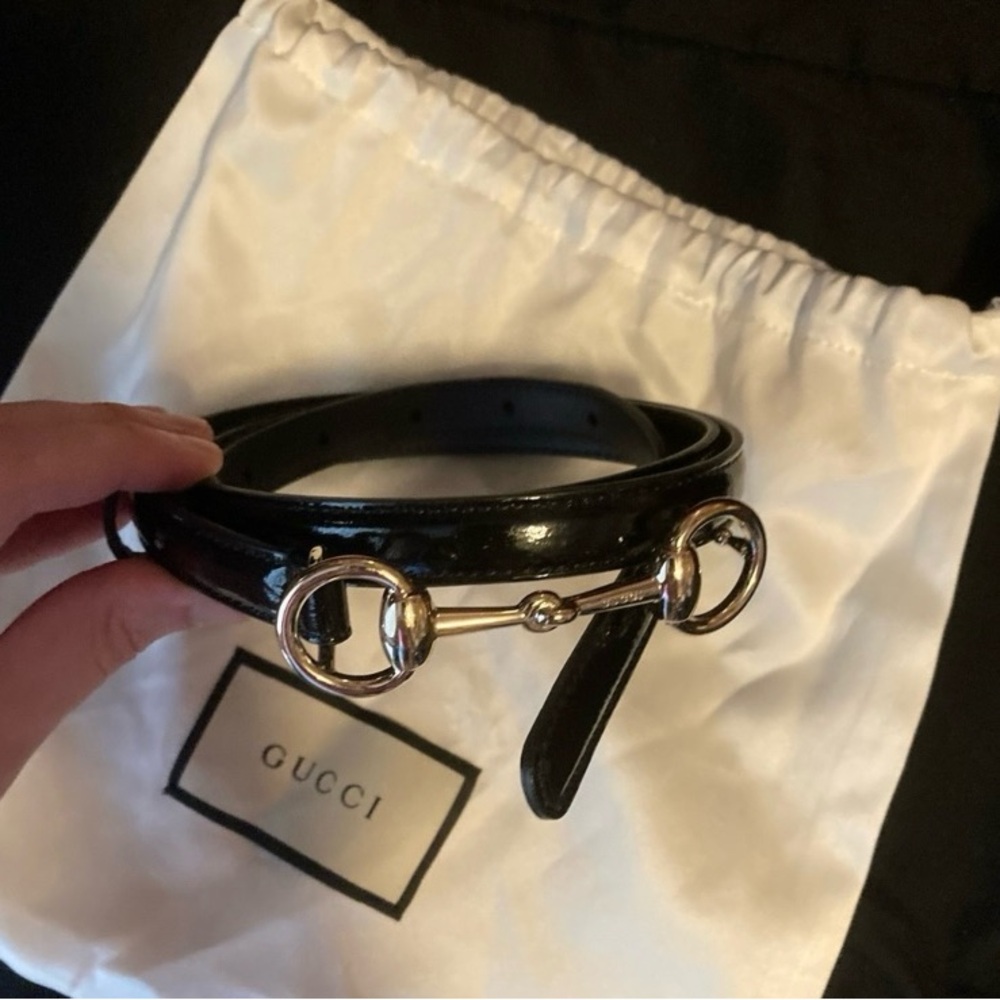 Black and gold Gucci belt